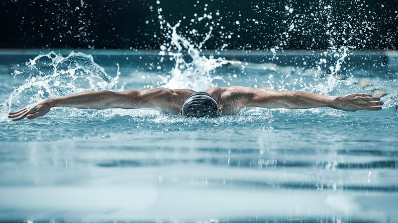 man swimming in a competition
